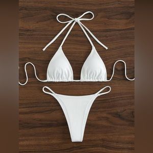 Brand new, white, ribbed bikini set is TWO sizes